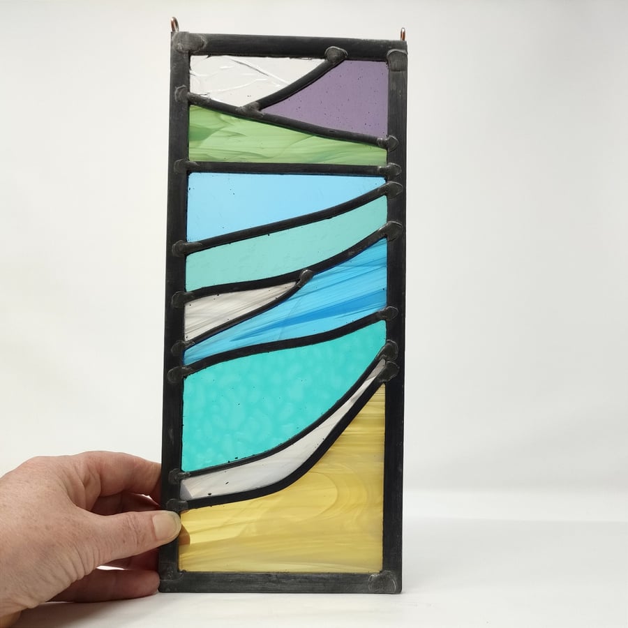 SOLD Stained glass beach scene seascape in muted colours, leaded hanging panel.