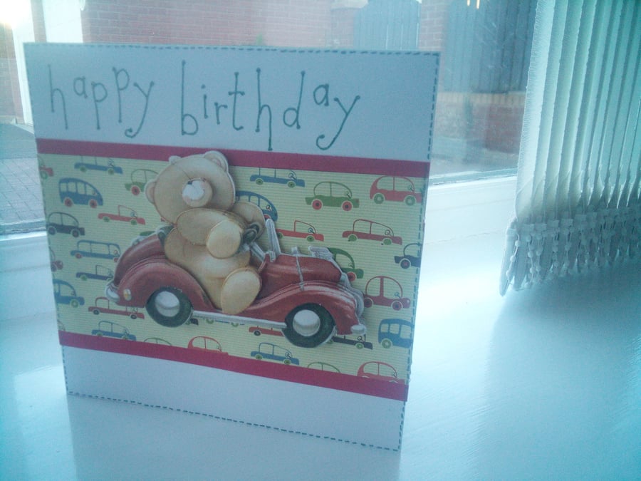 Cute teddy driving car birthday card