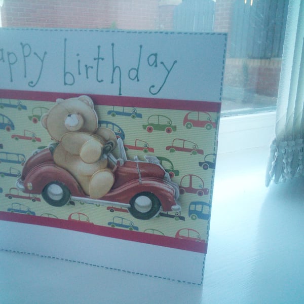 Cute teddy driving car birthday card