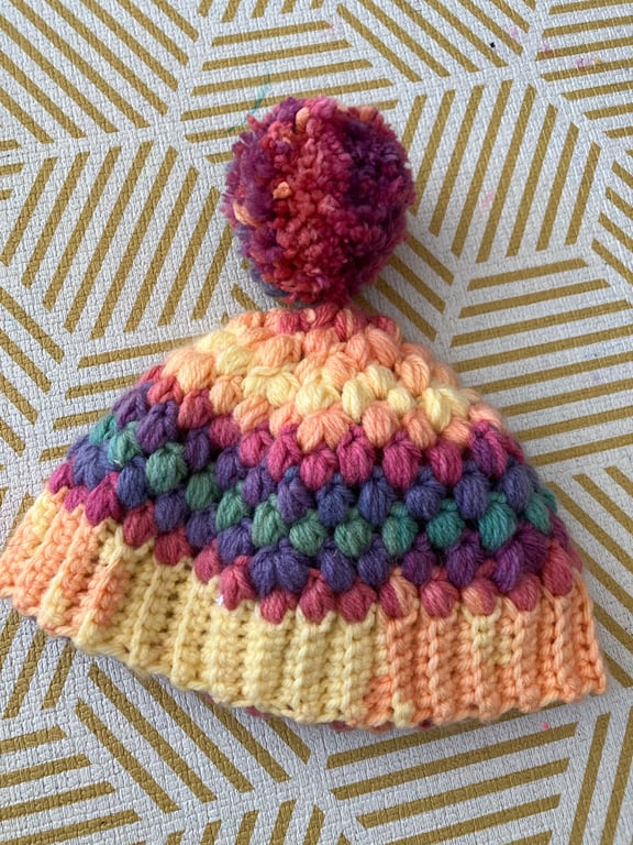 Crochet cosy rainbow Pom Pom bobble hat