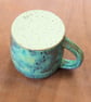 Stoneware pottery mug finished in a muli-colour green glaze - Image 5