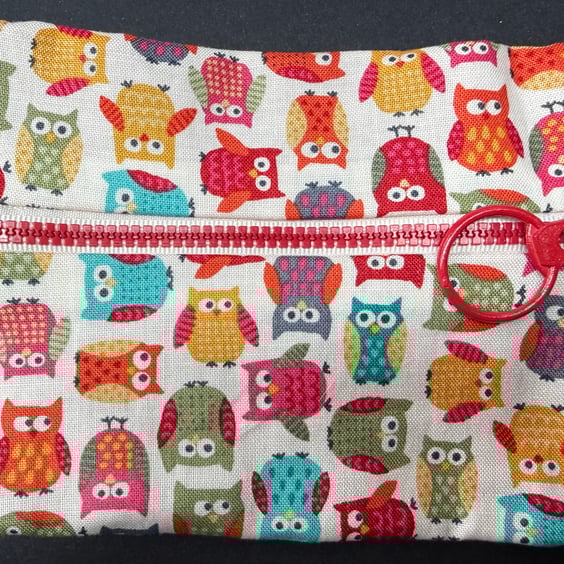 Small funky zipped pouch with white elephants on scarlet red background