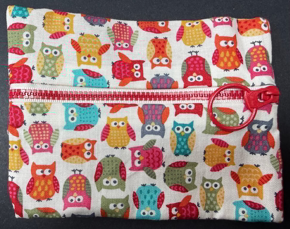 Small funky zipped pouch with white elephants on scarlet red background