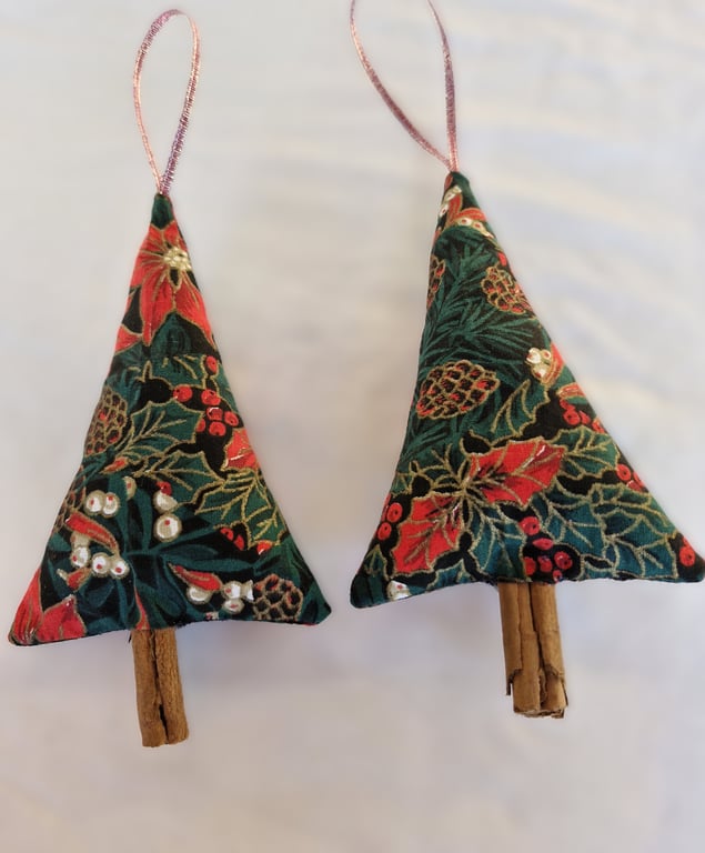 Pair of hand crafted fabric christmas tree decorations with cinnamon trunk