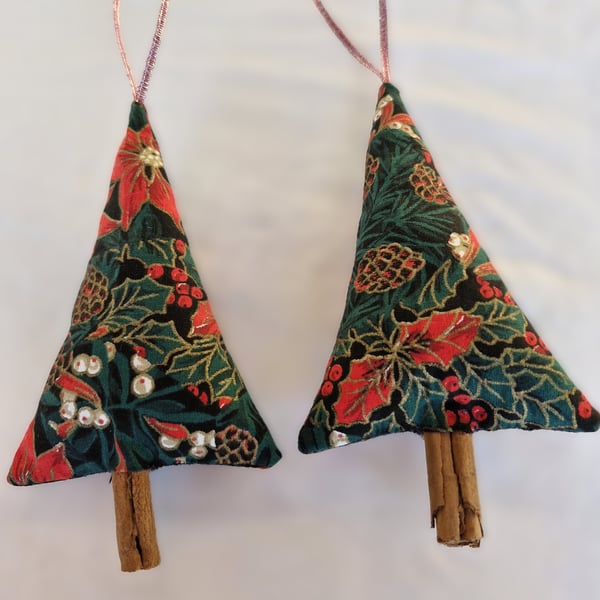 Pair of hand crafted fabric christmas tree decorations with cinnamon trunk