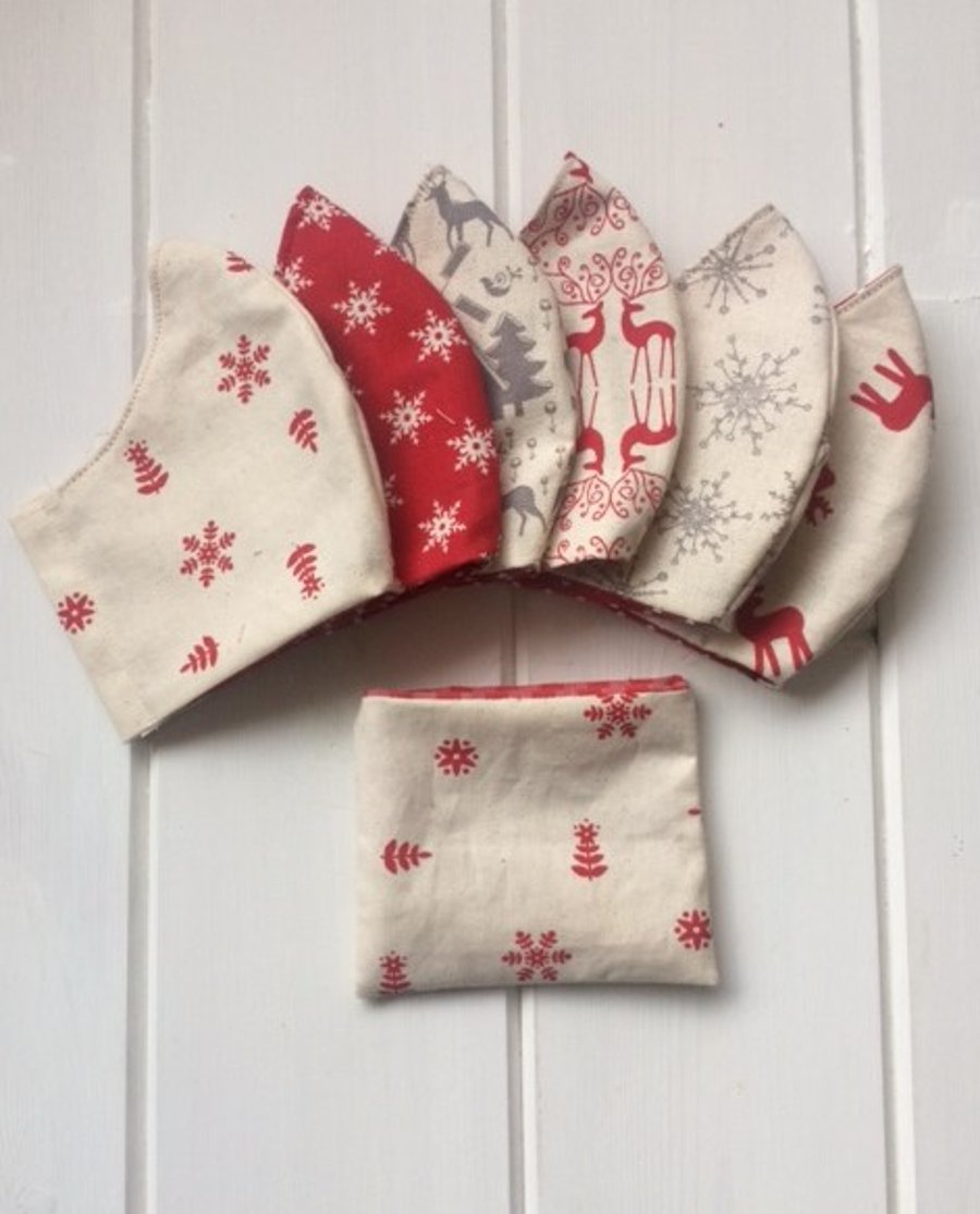 Two mix and match festive face coverings with storage pouch and free postage