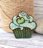 Apple cupcake brooch hand burned using pyrography. - Image 1