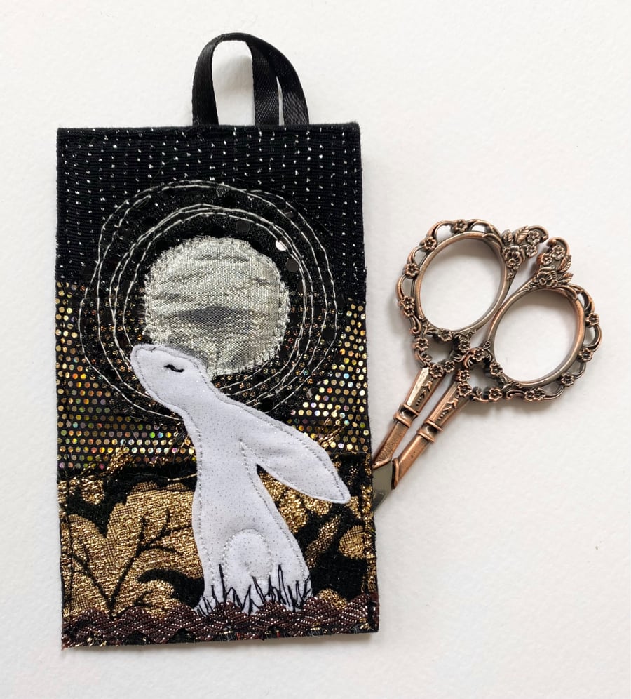 Up-cycled embroidered hare rabbit full moon home decoration.