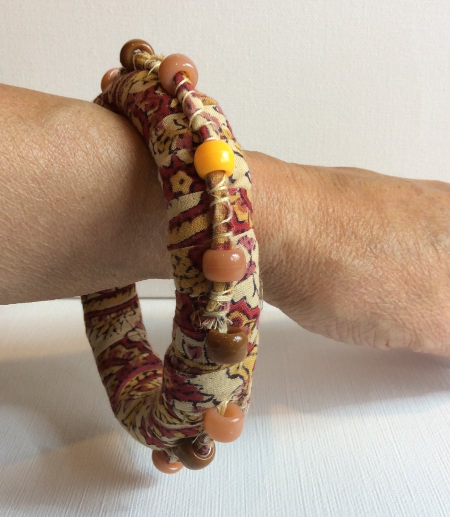 Bangle, bracelet, boho chic, fabric wrapped, slip on, peach, red with beads