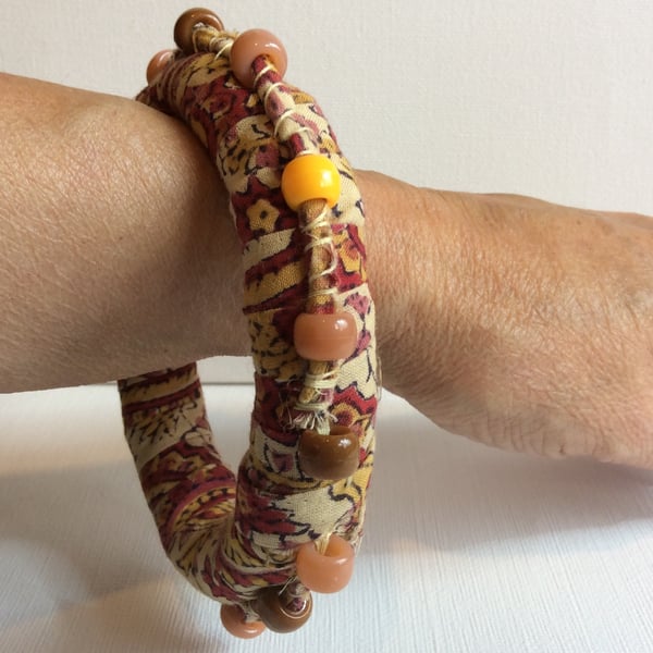 Bangle, bracelet, boho chic, fabric wrapped, slip on, peach, red with beads
