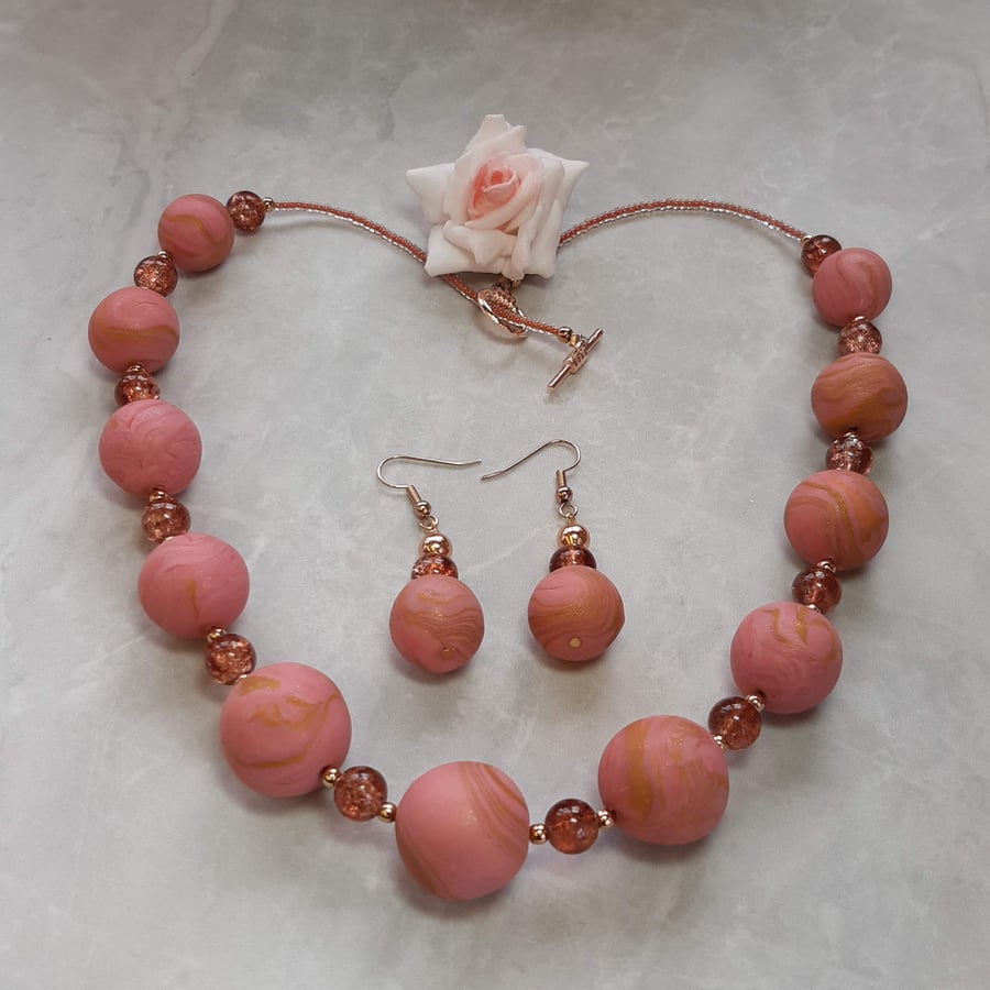 Elegant salmon and gold necklace and earrings set