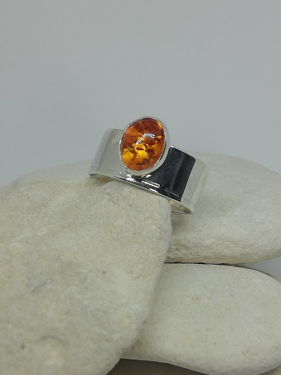 A Deep Silver Ring with an Amber Stone