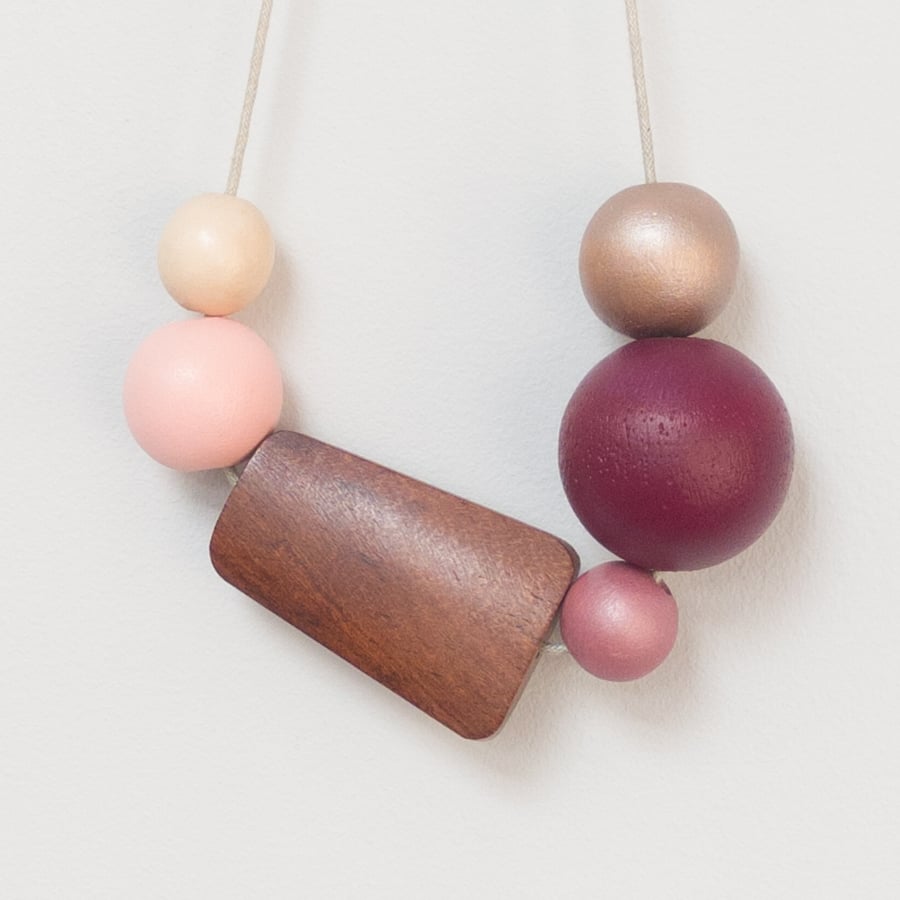 Bubbles - Flat wooden bead in dark natural, light pink, gold, plum and heather