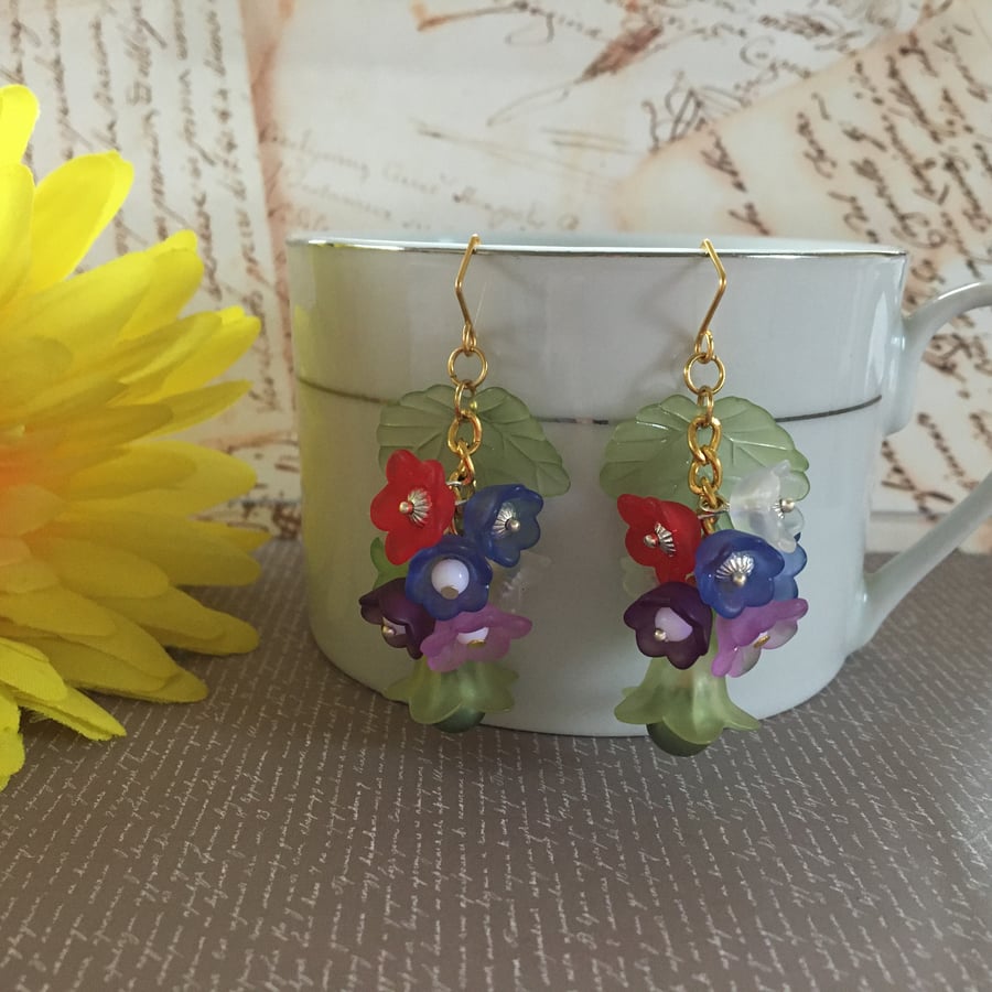 Bunch of flowers on green autumn leaf on gold plate chain Dangle earrings.