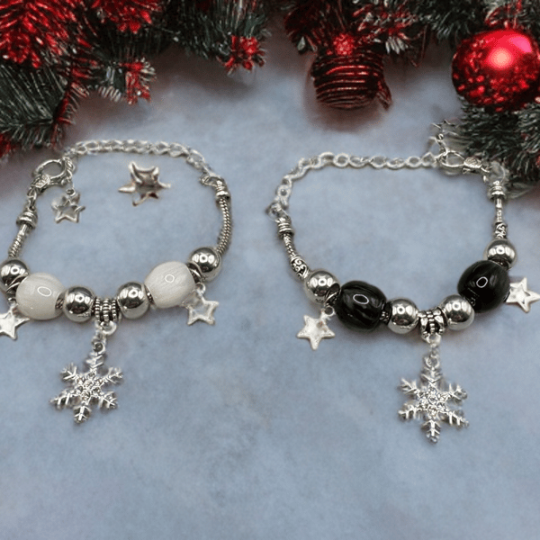 Christmas snowflakes charm bracelet with traditional  colours of red and green 