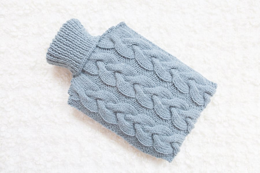 Hand knitted hot water bottle cover, cosy in blue. Rustic bedroom, home decor
