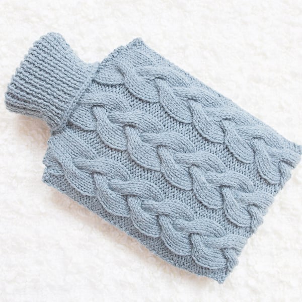 Hand knitted hot water bottle cover, cosy in blue. Rustic bedroom, home decor