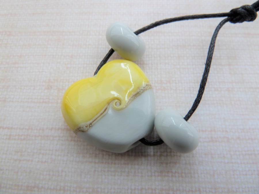 yellow and grey lampwork glass heart bead