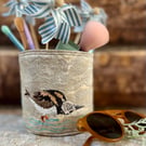 Textile storage pot with hand embroidered turnstone