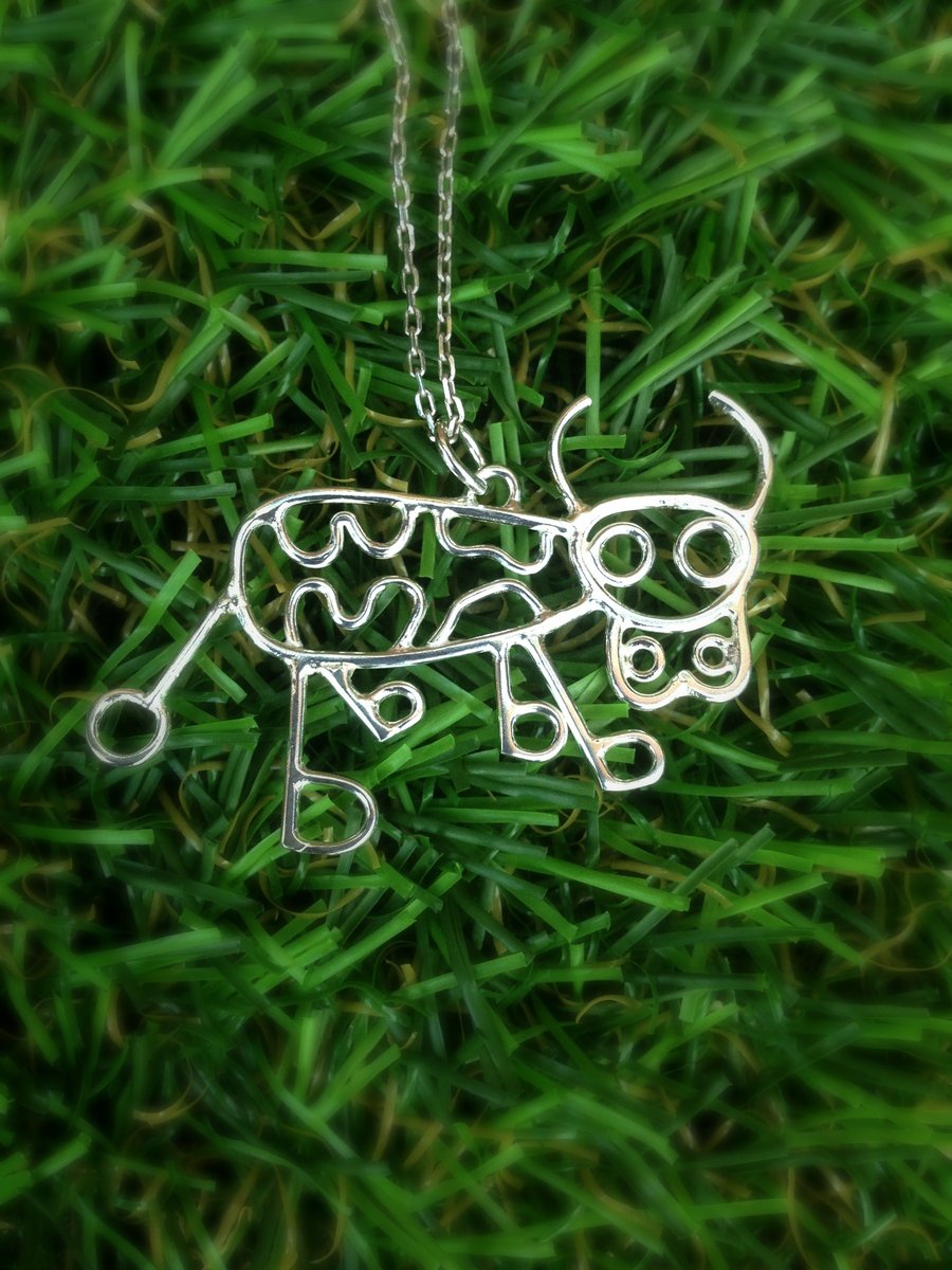 A sterling silver cow pendant from a childs drawing, kids drawing 