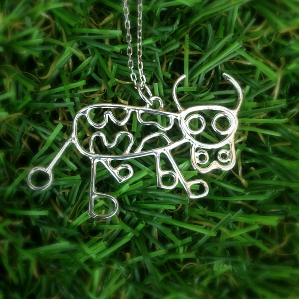 A sterling silver cow pendant from a childs drawing, kids drawing 