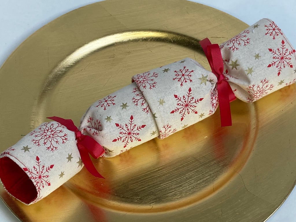 Pick and mix, reusable Christmas Crackers.  Linen-look cream with red snowflakes