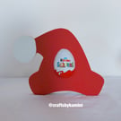 Santa's Hat Holding a Kinder Egg