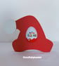 Santa's Hat Holding a Kinder Egg - Image 1