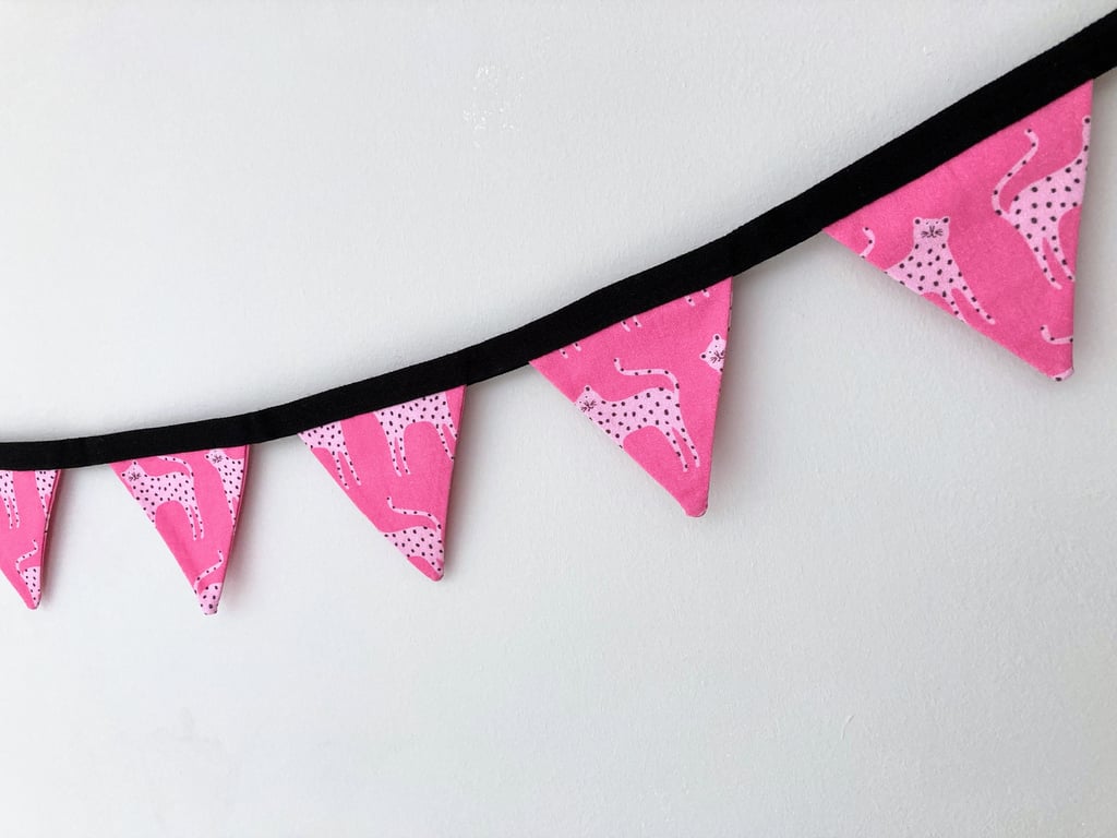 Leopards on bright pink double sided cotton fabric mini bunting.