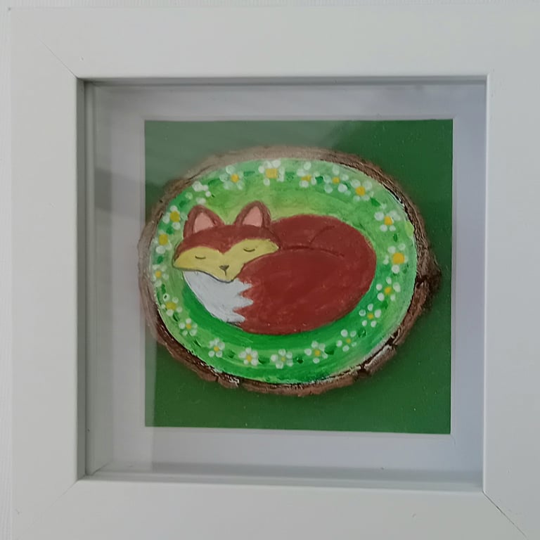 Fox in a box frame hand painted woodslice of a fox nestled ina white box frame