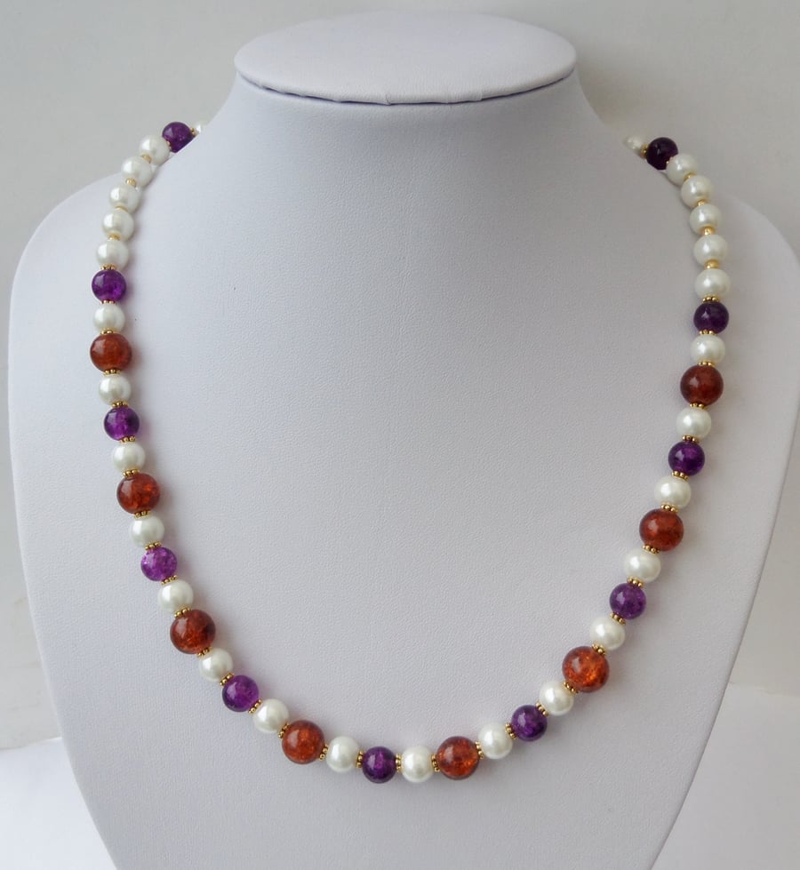 Cream pearl, purple and dark orange crackle bead necklace. 