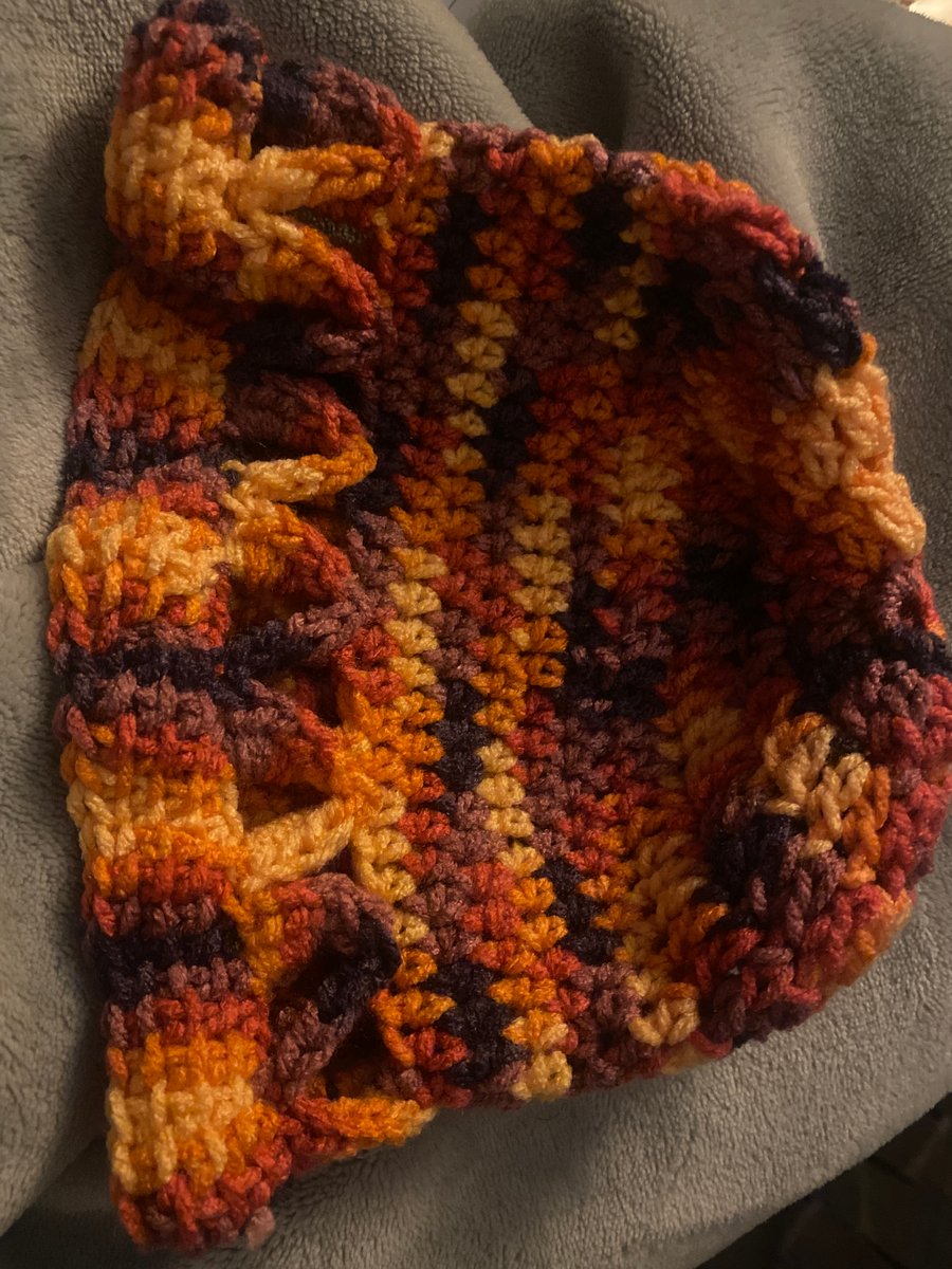 Multi-coloured crocheted spring hat for child