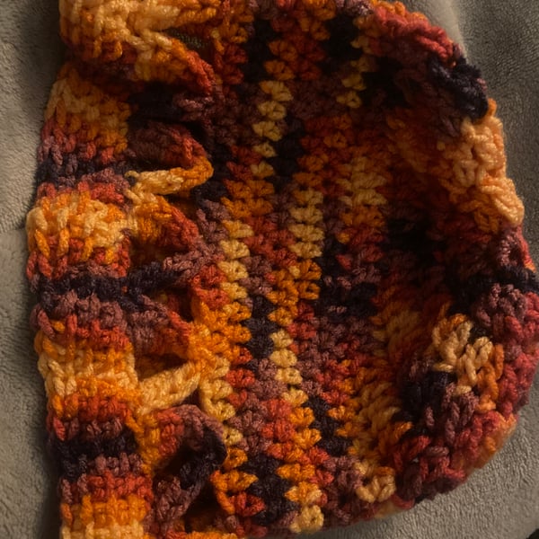 Multi-coloured crocheted spring hat for child