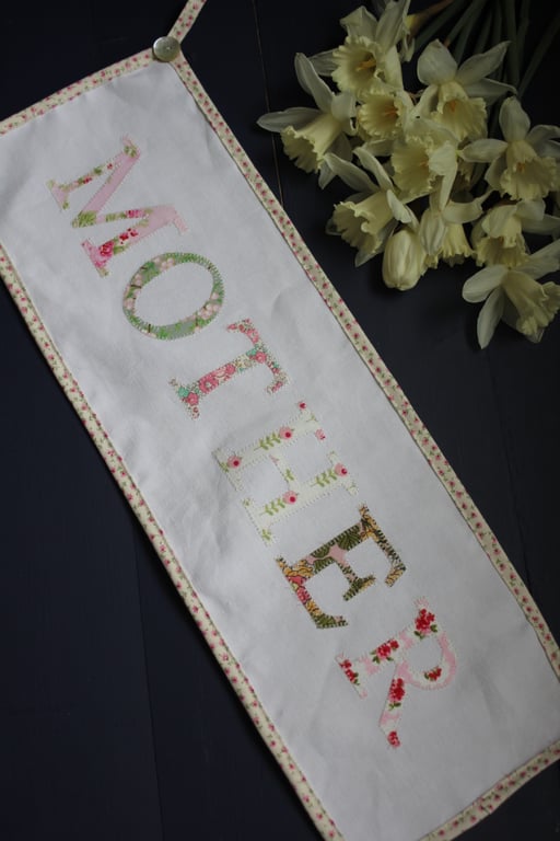 Floral 'Mother' fabric banner in shades of pink and green