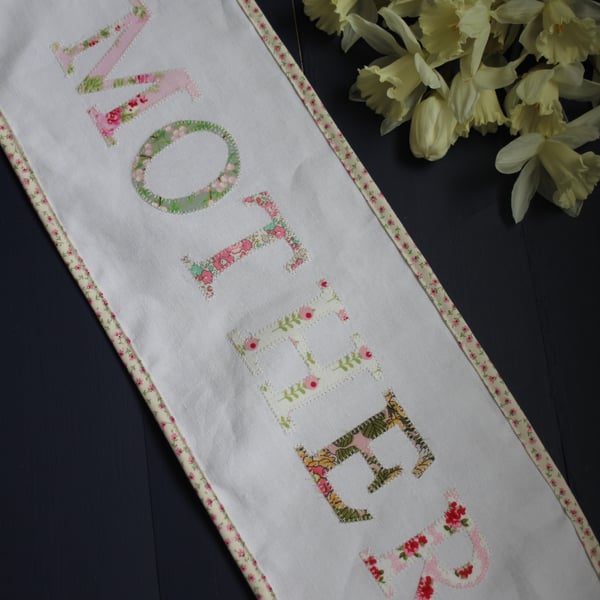 Floral 'Mother' fabric banner in shades of pink and green