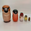 A charm of Finches mini bird nesting dolls