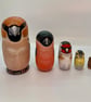 A charm of Finches mini bird nesting dolls
