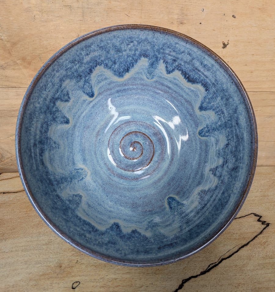 Medium to large sized pale blue wavy toasted bowl