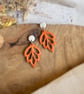 Autumn Minimalist Cutout Metallic Orange Polymer Clay Leaf Earrings - Image 5