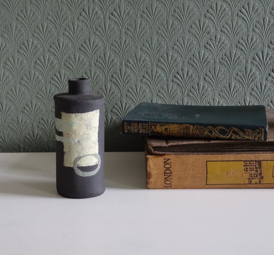 Trish.  Black ceramic dried flower vase, pastel abstract motifs.