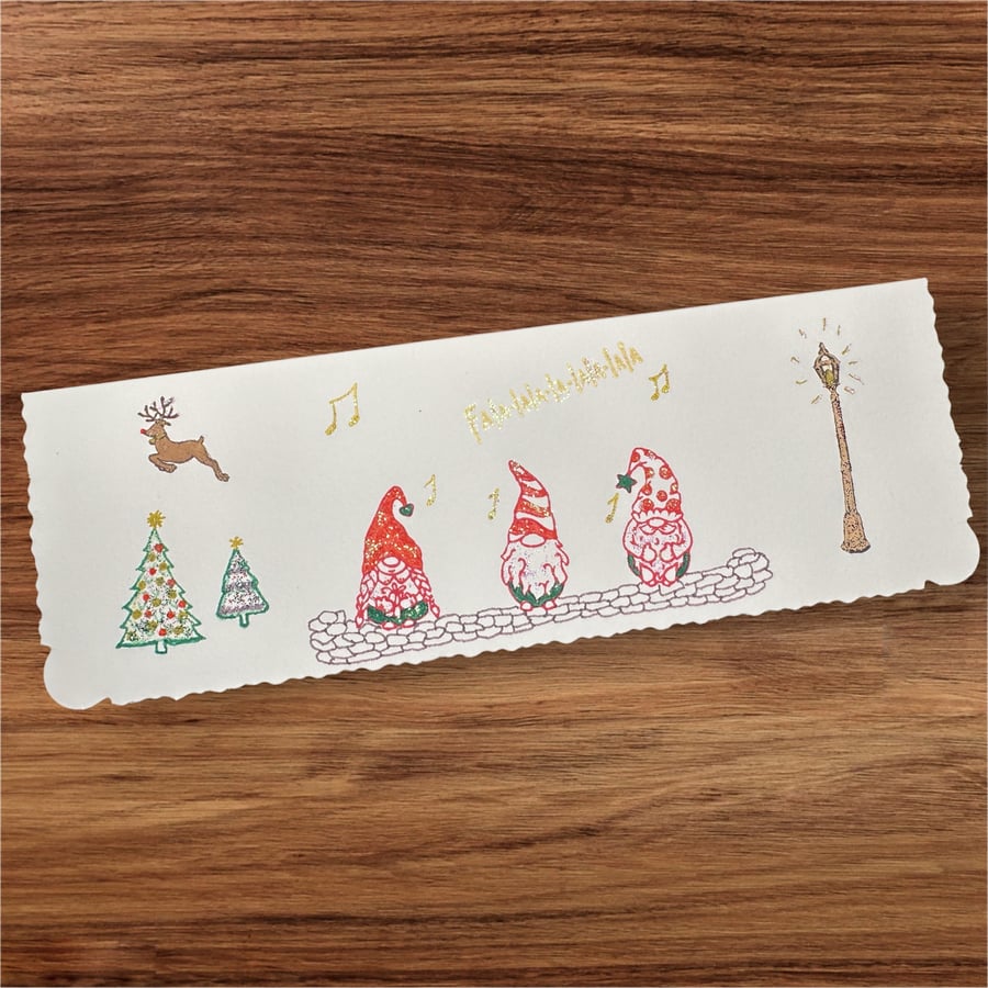Christmas card with 3 gnomes carol singing, Rudolph, Christmas trees, fa la la 