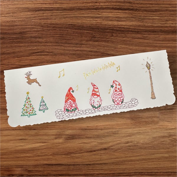Christmas card with 3 gnomes carol singing, Rudolph, Christmas trees, fa la la 