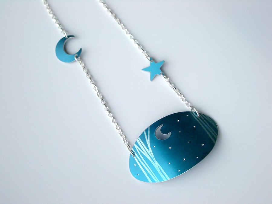 Moon and stars with trees oval necklace