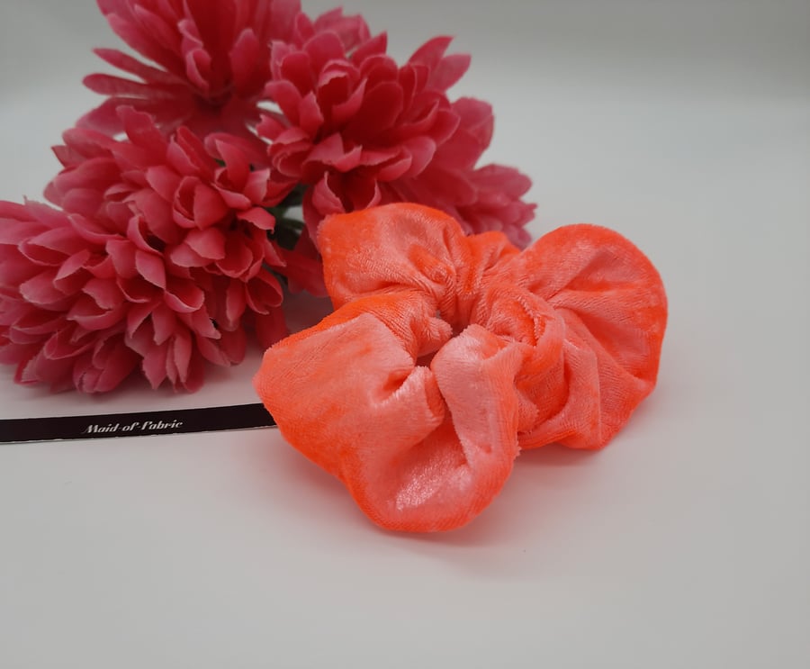 Hair scrunchie in neon coral crushed velvet.  Free uk delivery.  