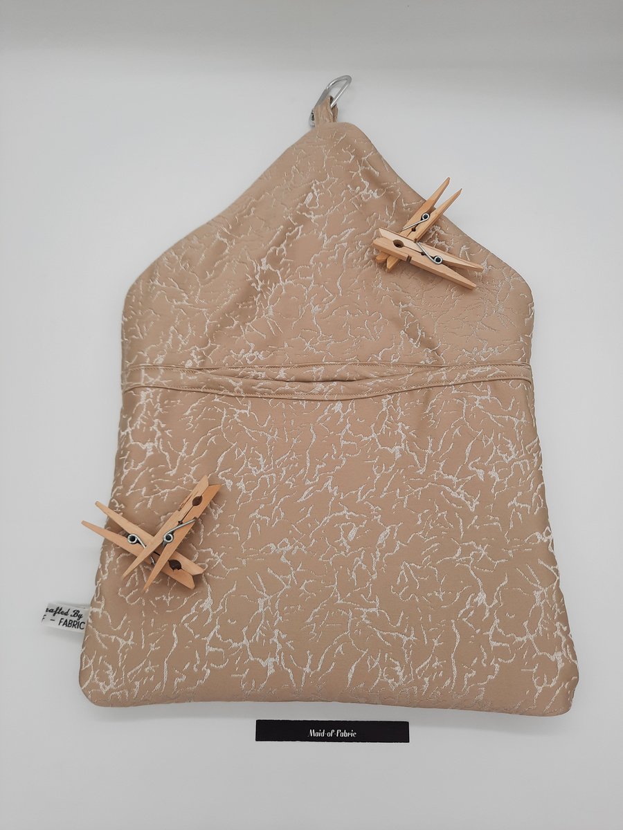 Peg bag, clip on in beige pattern fabric.  