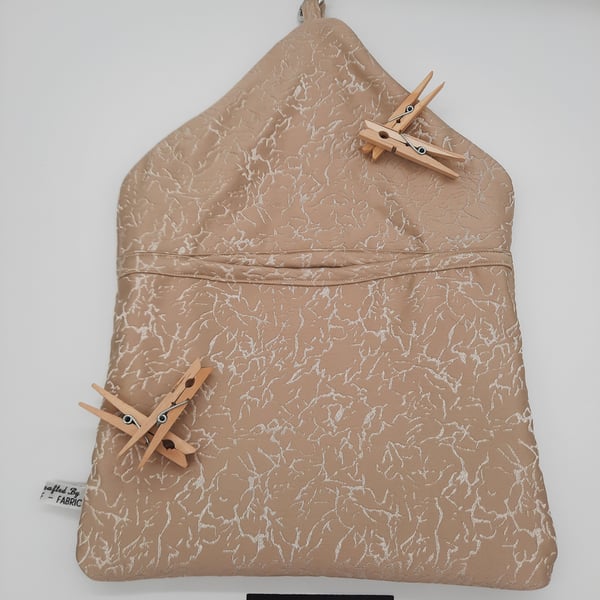 Peg bag, clip on in beige pattern fabric.  