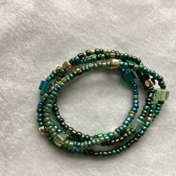 Stretch beaded bracelets from beaded string, square beads.
