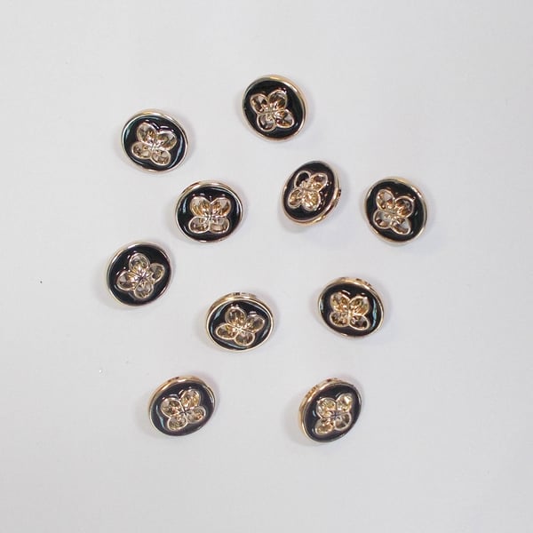 Gold and black faux metal flower shank buttons 15mm approximately. Pack of 10