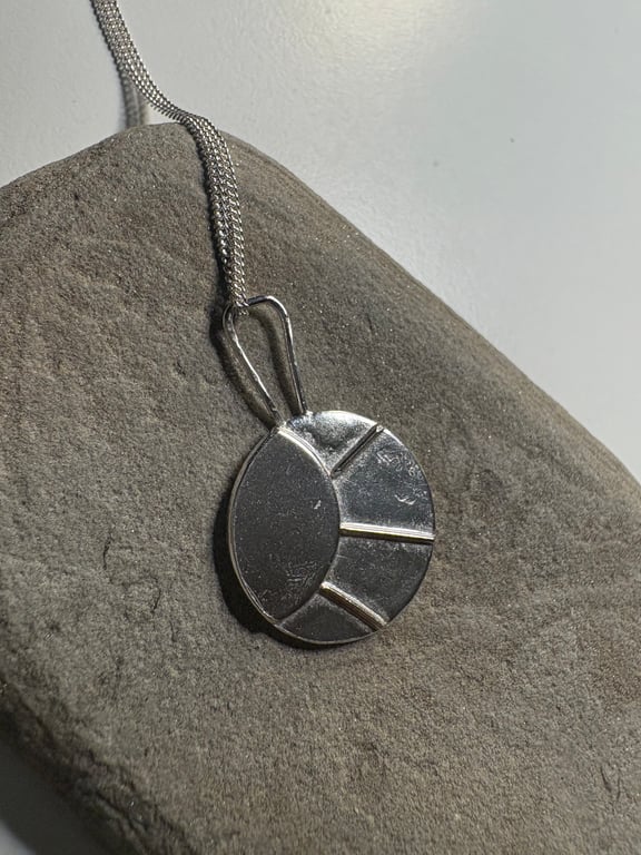Sterling silver sun pendant on silver chain