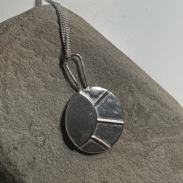 Sterling silver sun pendant on silver chain